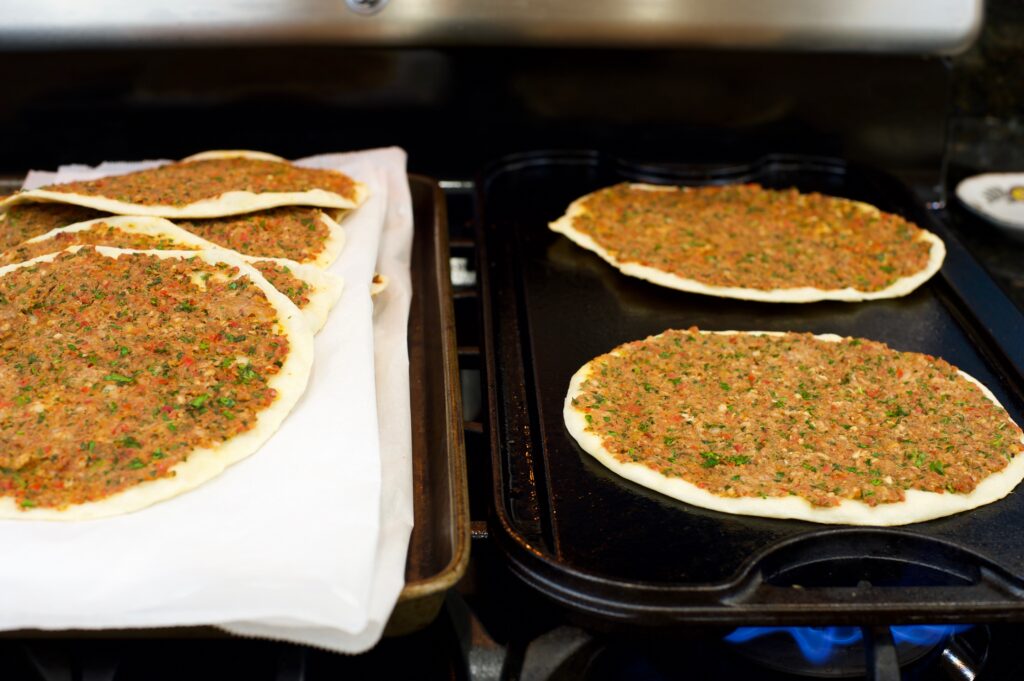 cooking lahmajun on griddle